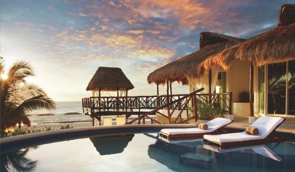Pool at private bungalow at sunset