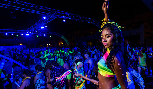 Girl dancing at an outdoor party at night