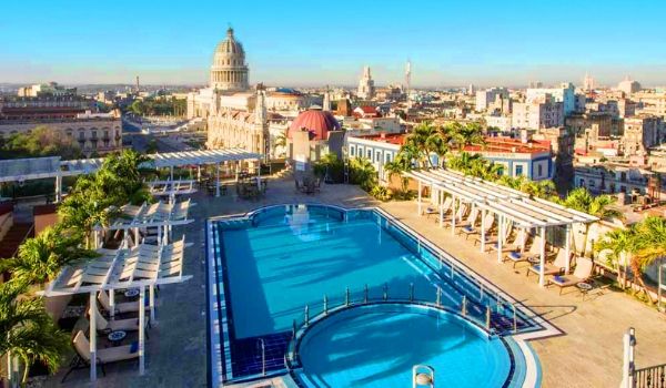 Rooftop bar and pool overlooking the historical buildings of Havana