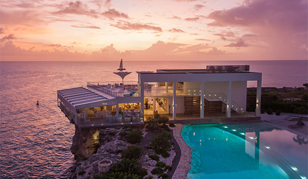 Resort overlooking the ocean at sunset