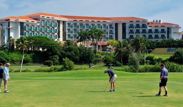 People golfing on the pristine greens of Varadero Golf Club