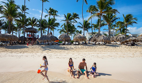 Family playing in the sand on Bavaro Beach