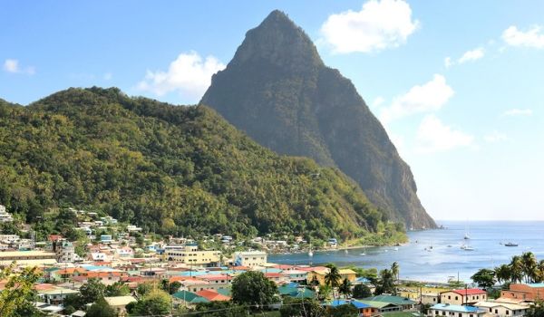 Houses overlooking the ocean with Pitons in the background