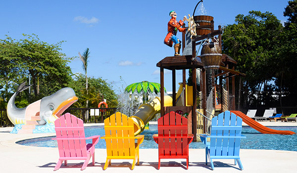 Colourful chairs overlooking the kids pool at Family Club at Grand Riviera Princess All Suites and Spa Resort