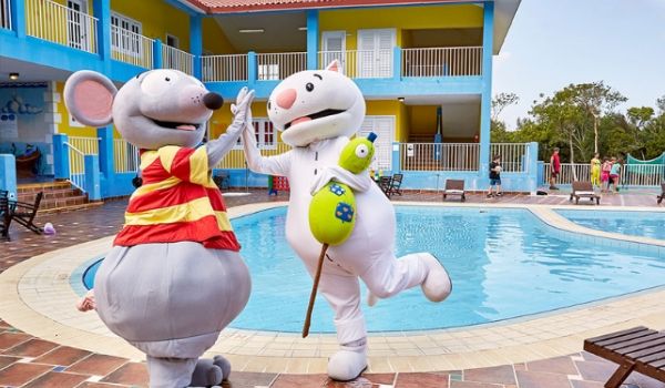 Resort mascots by kids pool