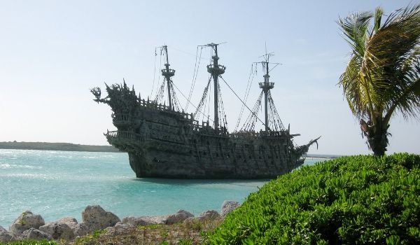 Replica old pirate ship anchored off the Bahamian coast