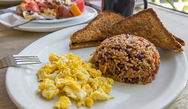 Gallo Pinto on a plate with toast and scrambled eggs
