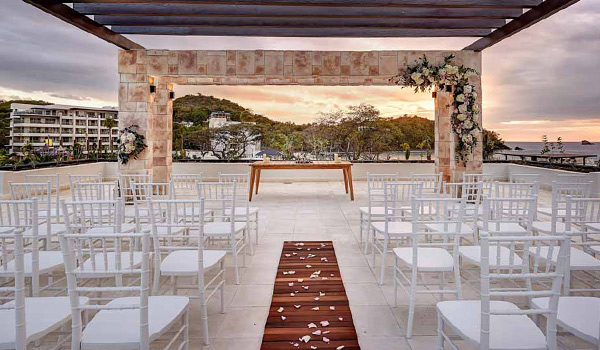 Wedding ceremony on a rooftop at sunset