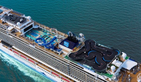 Aerial view of a cruise ship with a racetrack and water park