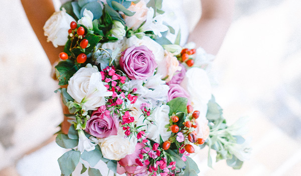 Colourful bouquet with yarrow, roses and eucalyptus