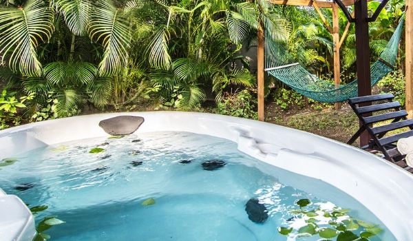 Hot tub surrounded by lush forest