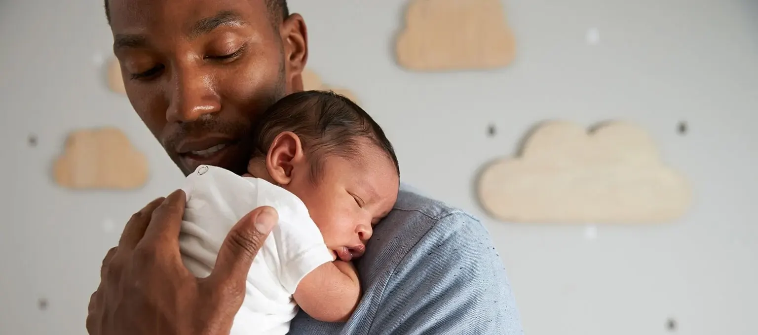 Dad nursing baby to sleep