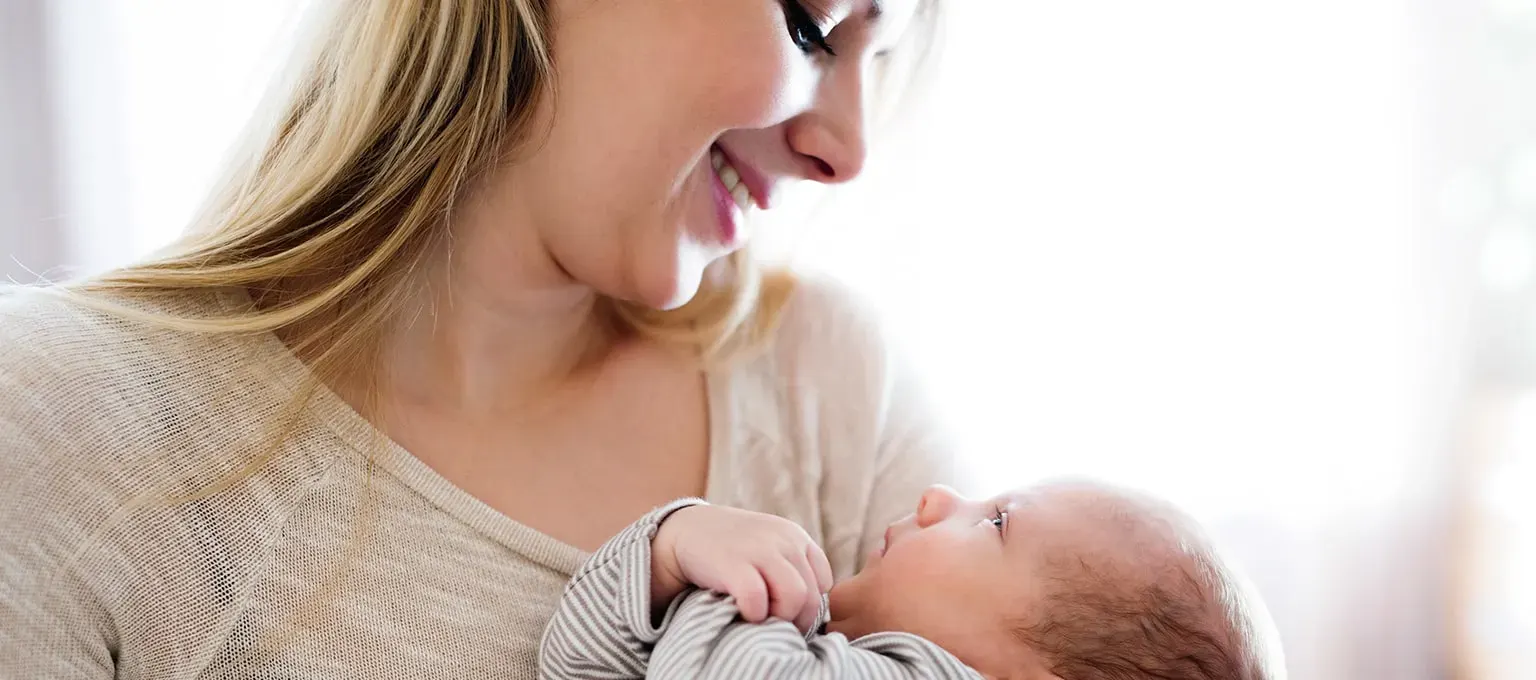 When do babies hold their head up