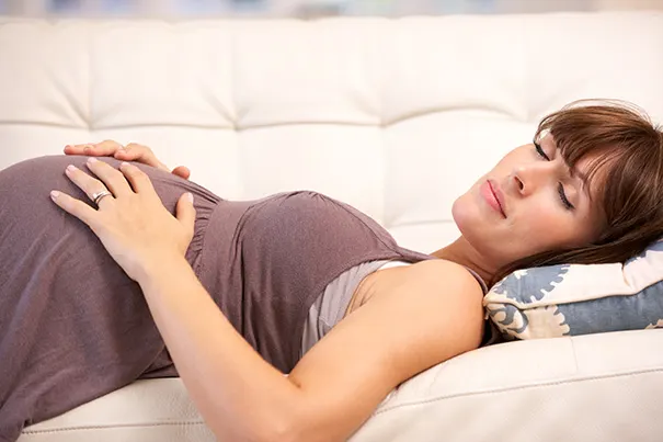 Mum-to-be taking a nap on the couch