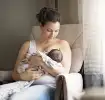 Mum breastfeeding her newborn baby