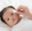 Cleaning baby’s face eyes ears nose