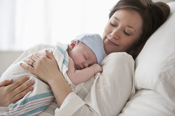 Mother Soothing Newborn Baby 