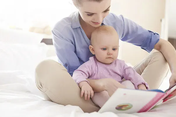 Mom reading to her baby