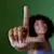 Smiling woman holding up her hand in the letter “L.” to represent the brand “L.”