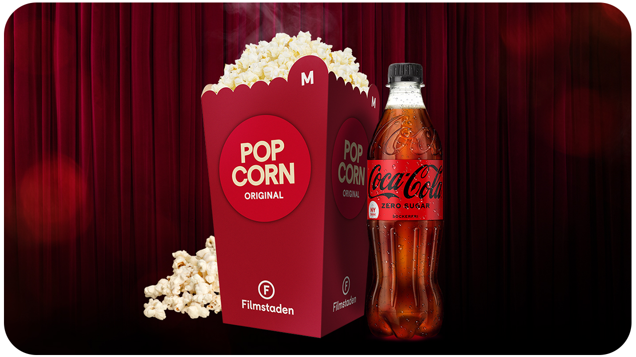 Bild på popcorn och läsk på röd bakgrund.