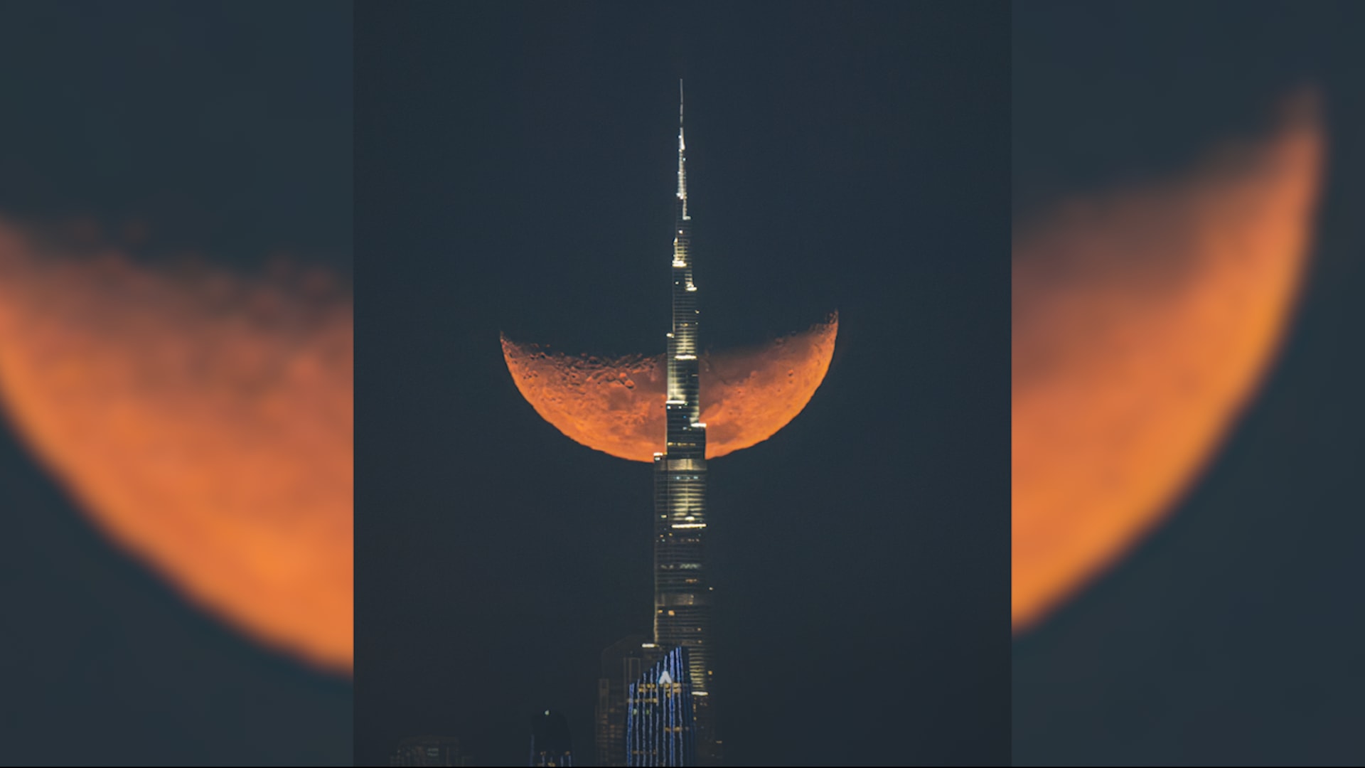 في مشهد رائع.. مصور لبناني يوثق القمر في "رقصة" ساحرة مع برج خليفة