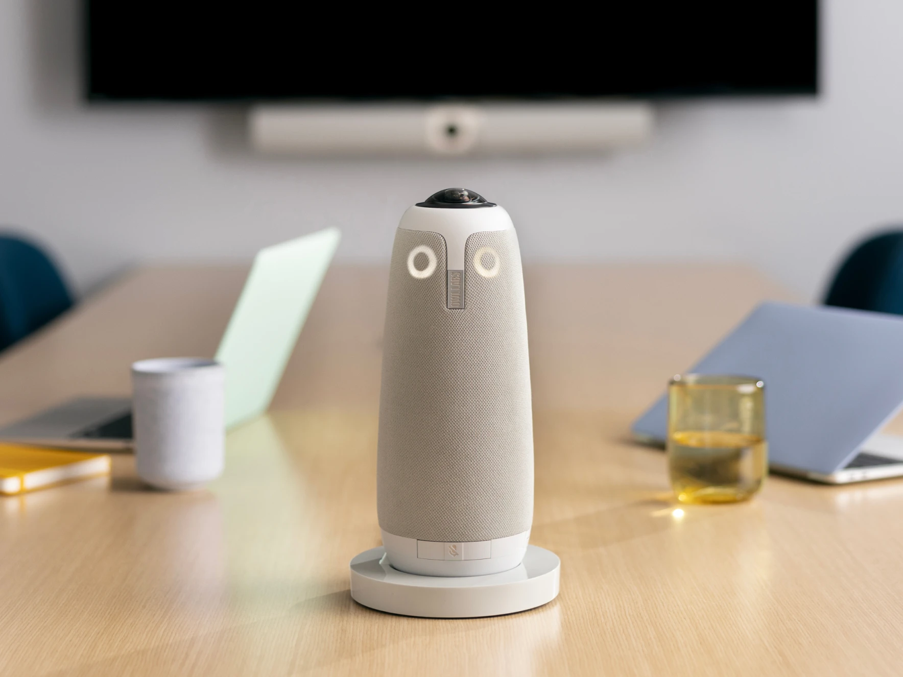 Meeting Owl 3 Stand with Meeting Owl featured in a conference room setting