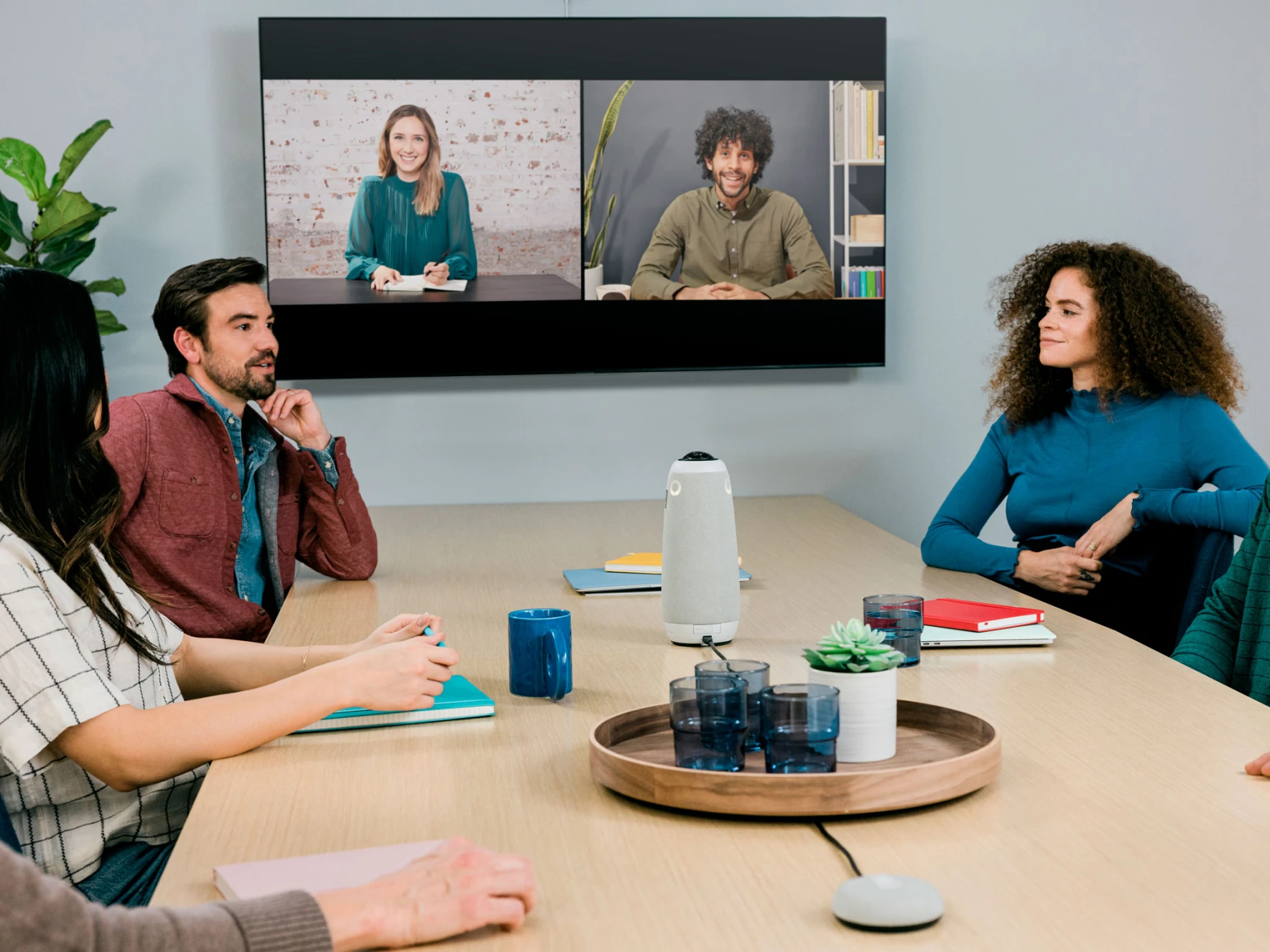 Meeting Owl 3 and Expansion Mic being used in a video conference meeting