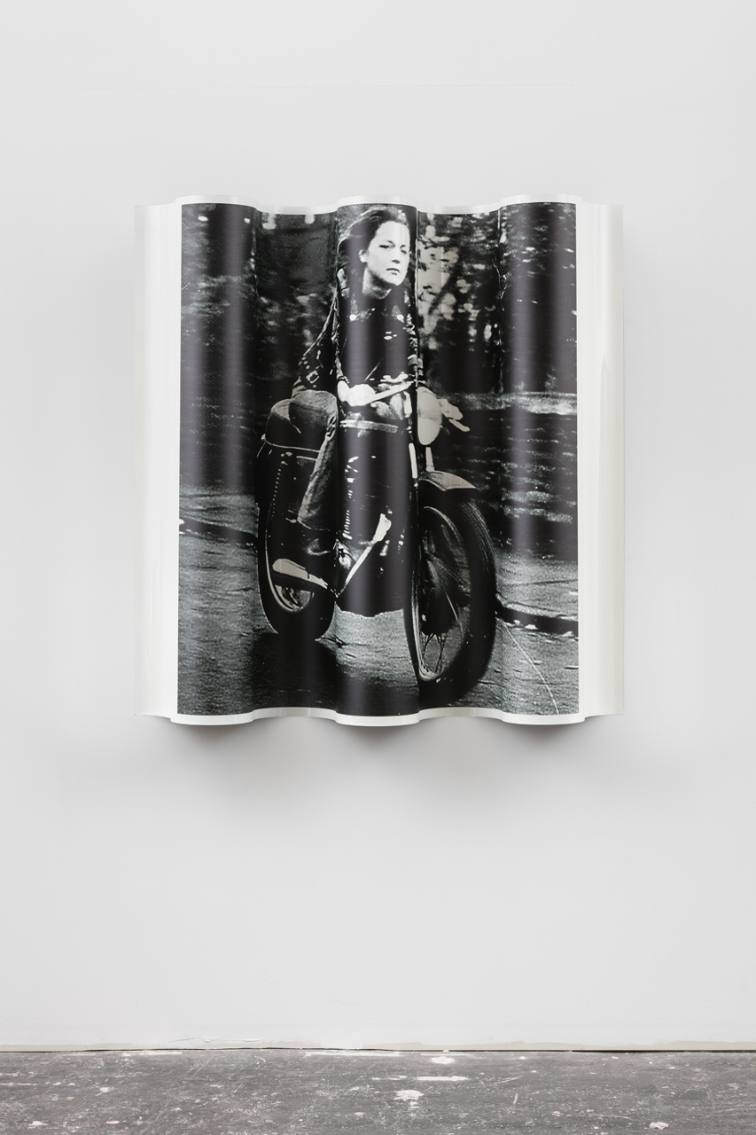 b&w woman on motocycle looking view 2 floor 