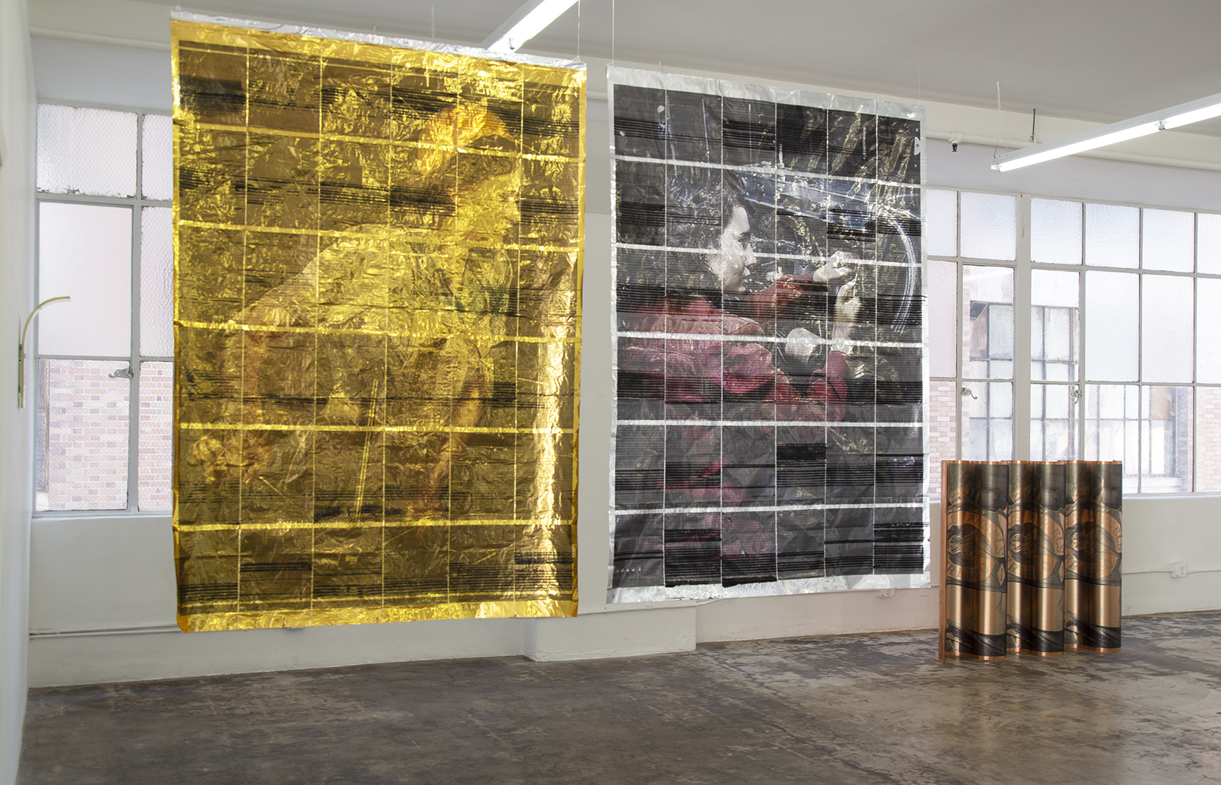 Joan install 3 window tapestries hanging 