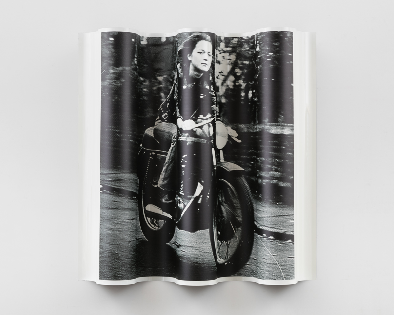 woman on motocycle looking close up 