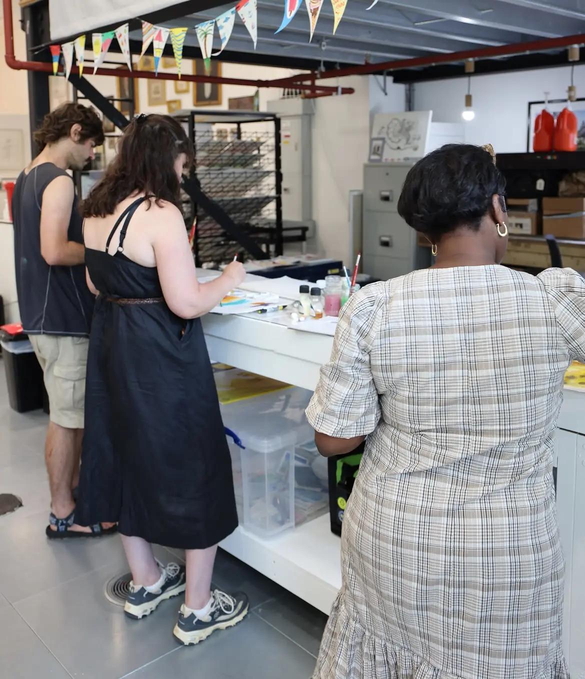 Artist taking part in a hands-on colour mixing workshop during their visit to Colart HQ.