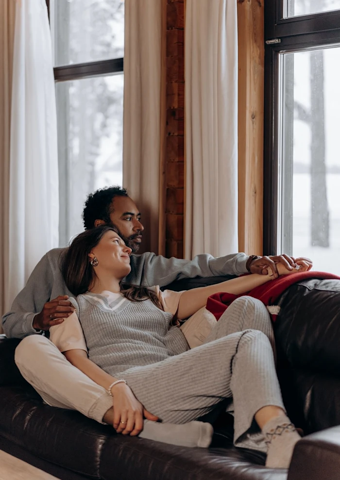 man and woman on couch