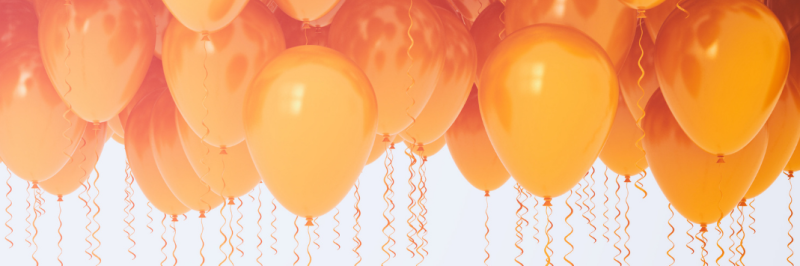 Orange balloons on ribbons