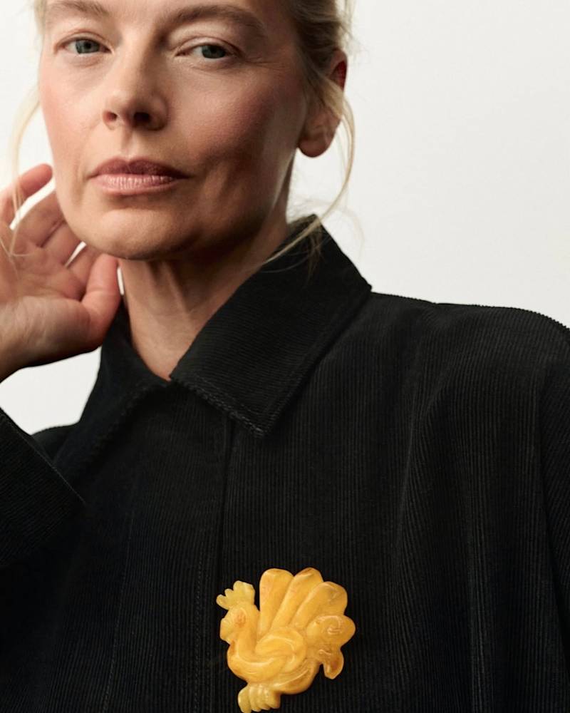 Big amber brooch whose form is inspired by a rooster-shaped bread that is baked in the town of Kazimierz Dolny. 