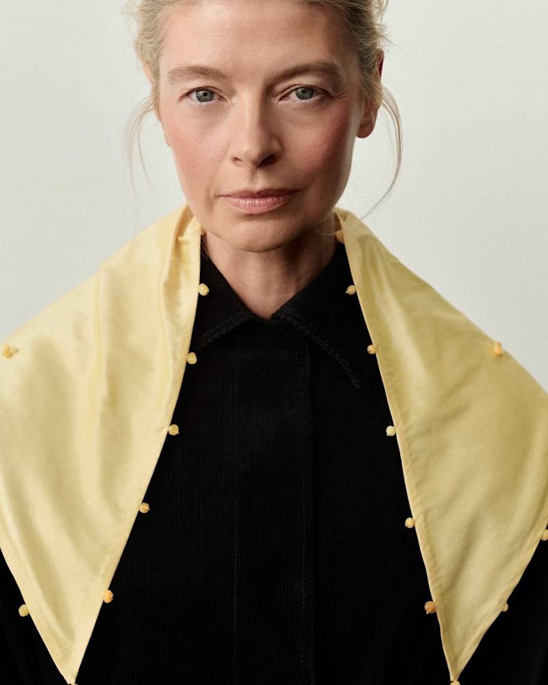 Shawl made from silk shantung fabric with its characteristic irregular slubs, embellished with natural amber beads.