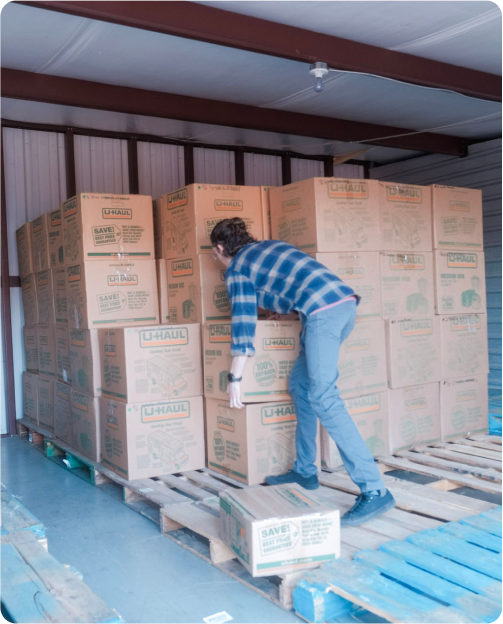 the eChapps team moves boxes from a storage unit