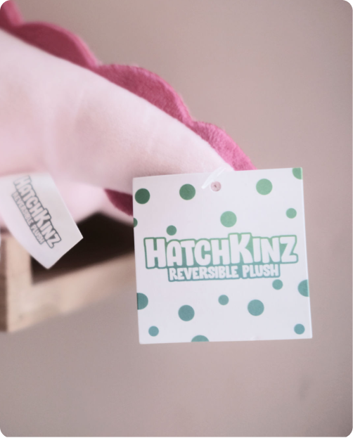 A photo of an eChapps Hathkinz toy, with the Hatchkinz label showing