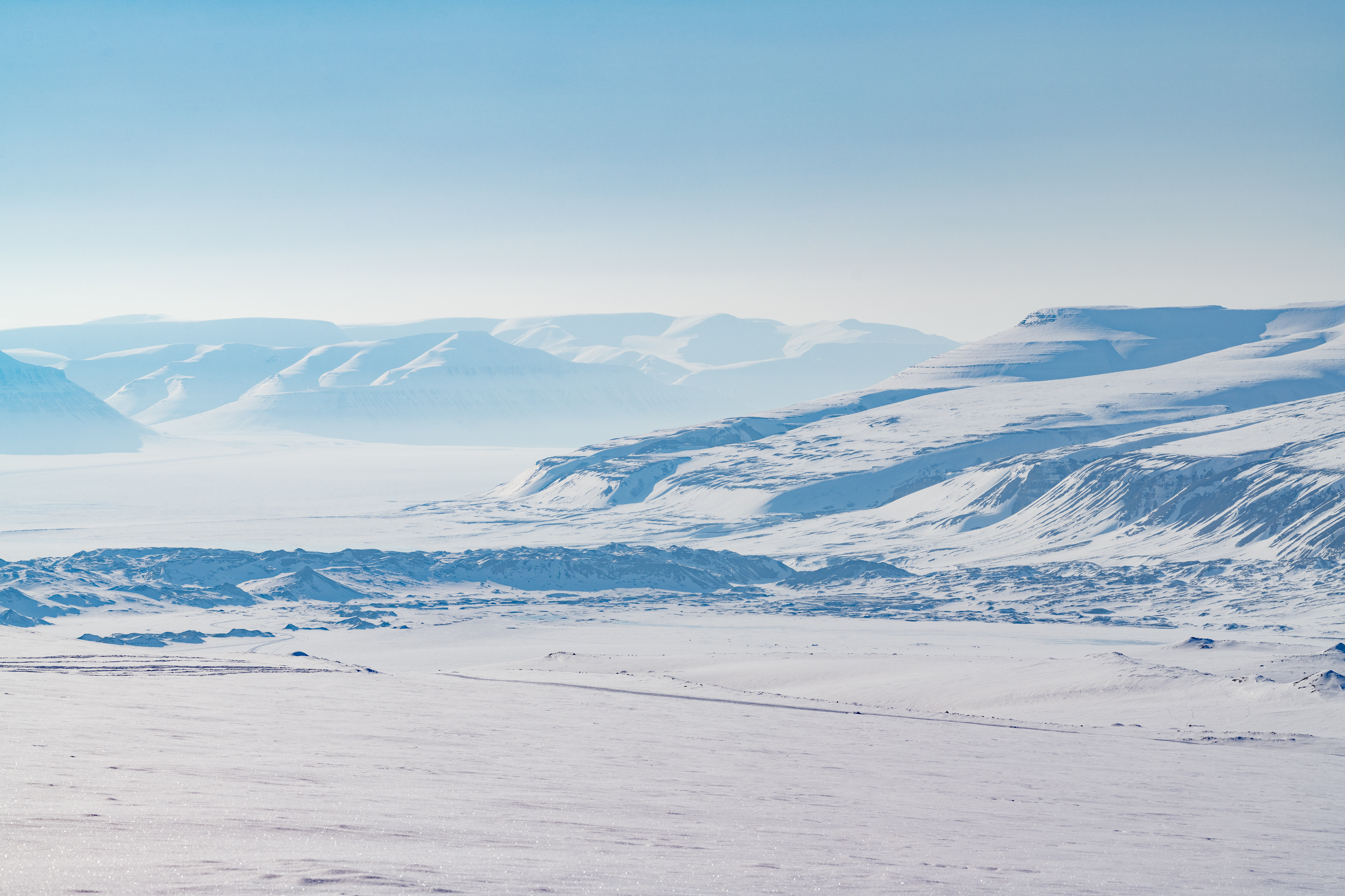 Snowy landscape over Svalbard during Sunny Winter. 