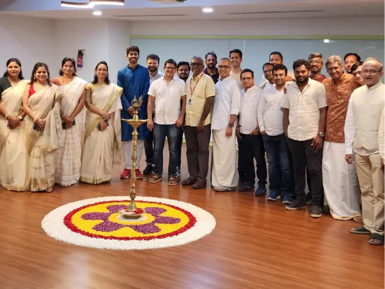 Team members gathered together during a cultural celebration