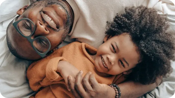 Father and son smiling together