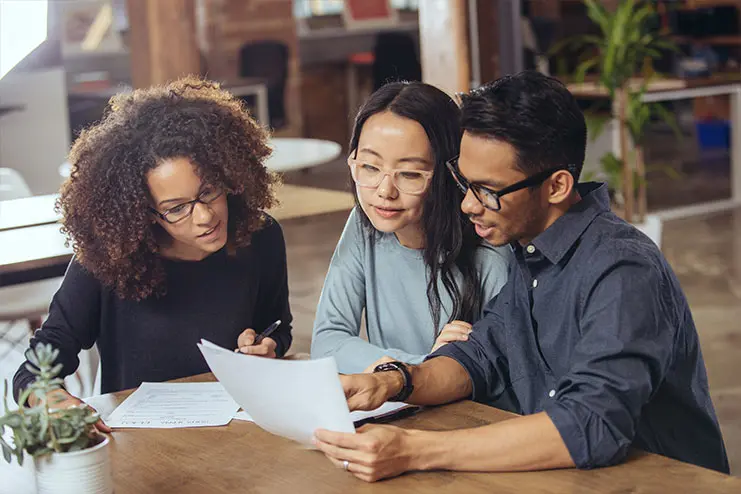 young-adults-looking-at-documents