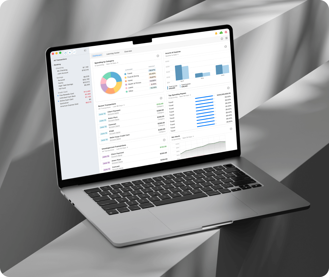 A laptop displaying a personal finance dashboard with charts, spending categories, recent transactions, and budget summaries. The device sits on a gray, abstract surface.
