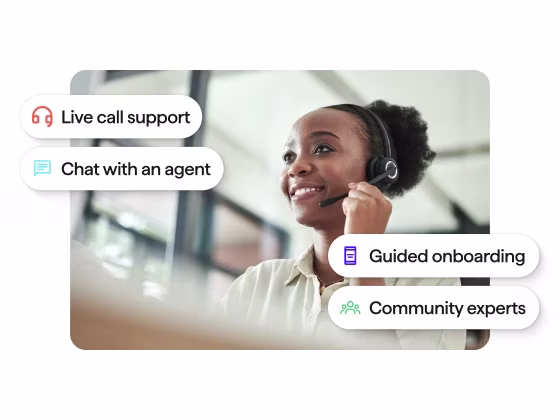 Photo of a customer support agent wearing a headset, overlaid with four feature labels: Live call support, Chat with an agent, Guided onboarding, and Community experts.