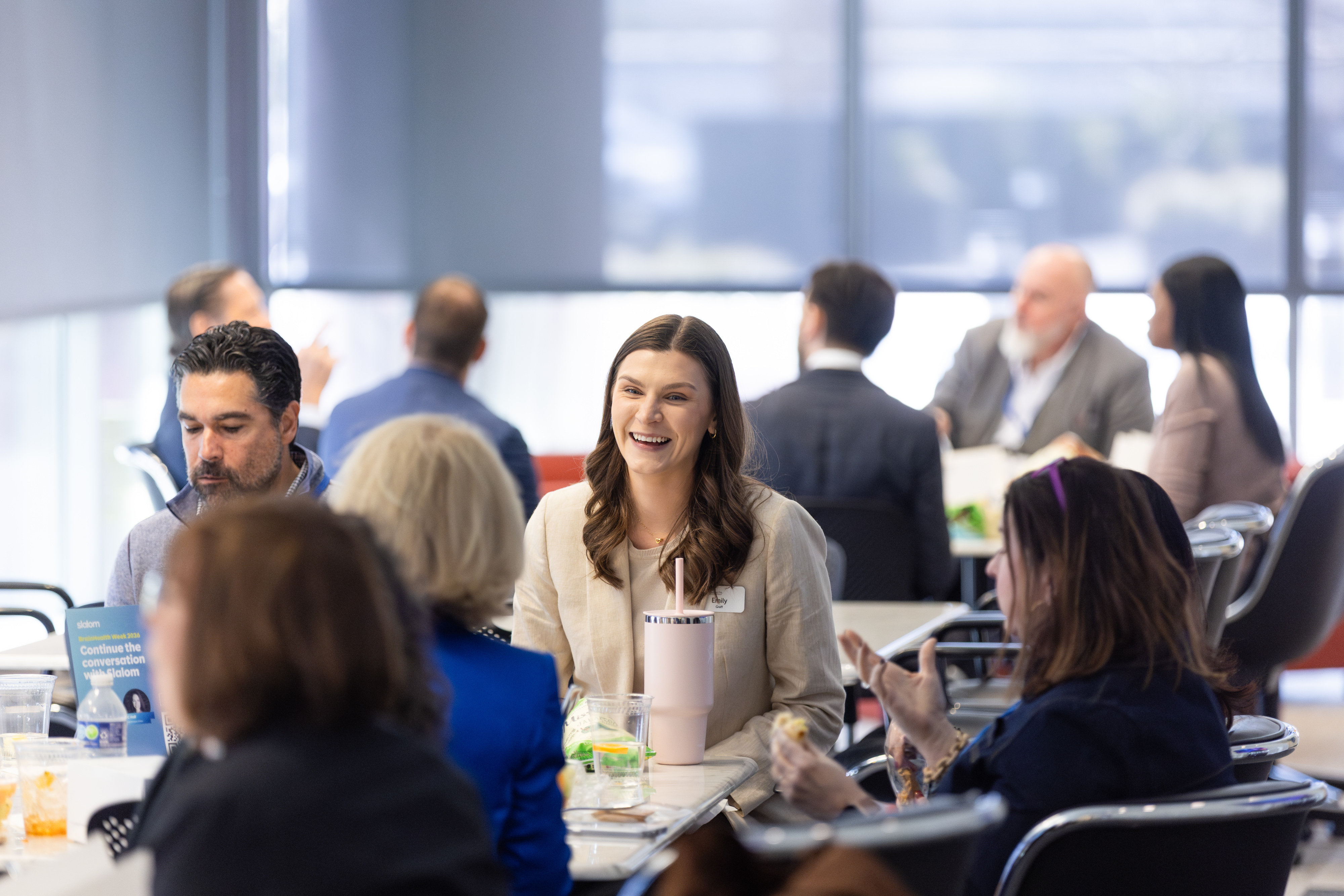 Guests enjoy lunch in the sunlit reception hall at Center for BrainHealth in Dallas, Texas.