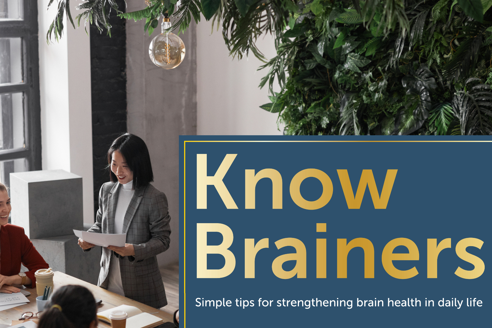 Diverse business team works in well-lit conference room created using biophilic design.