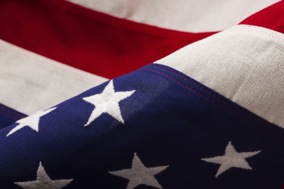 A close-up of an American flag flowing in the breeze.