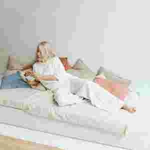 Senior woman reading a book in a peaceful room.