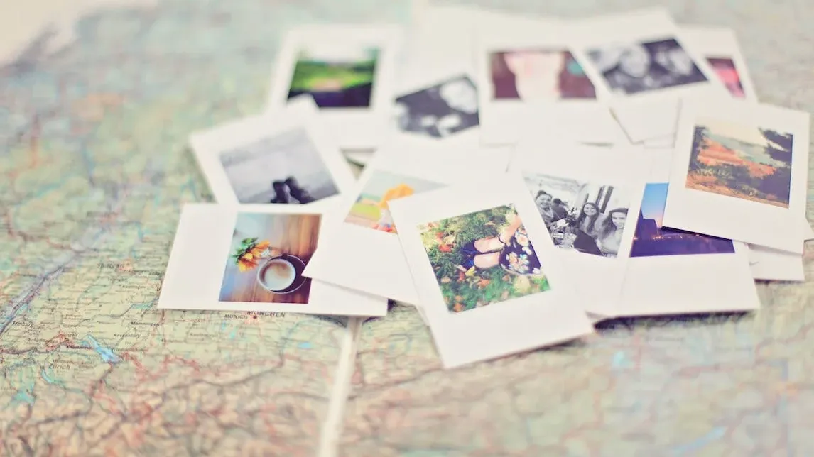 Colorful polaroid pictures on a map