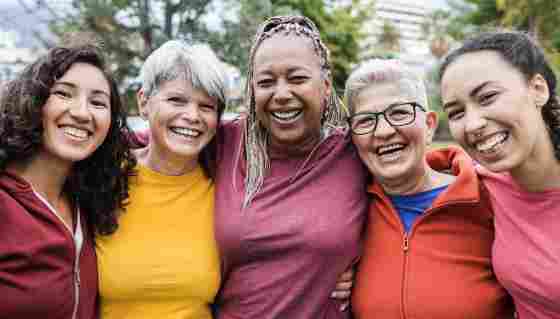 Happy multi generational women having fun together - Multiracial friends smiling on camera after sport workout outdoor