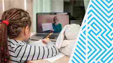 A young child at a computer, interacting with a teacher through a virtual lesson.